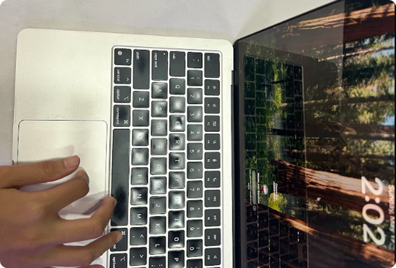 Laptop with hands typing